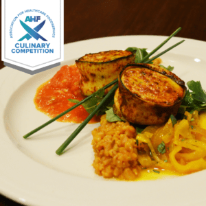 Faux Bacon Wrapped Scallop Mousse with orange scented Farro, Saffron Braised Fennel, Garlic Tomatoes and Arugula