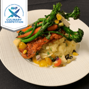 Southwestern Ancho Pork with Yukon Gold Mash, Sauteed Baby Carrots and Broccolini, topped with Jicama and Pear Slaw