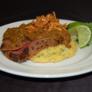 Fire Roasted Poblano Flank Steak over Cheesy Potato Grits
