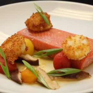 Poached Sockeye Salmon with Potato Crusted Vichyssoise, Cherry Tomatoes and Shittake Mushrooms glazed in a Roasted Potato Sauce, and Scallions